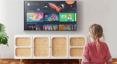 A girl looking at her personalised children's profile homescreen on a CHiQ brand TV running the Google TV operating system